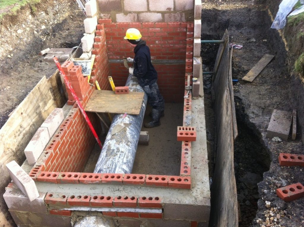 Construction worker laying bricks