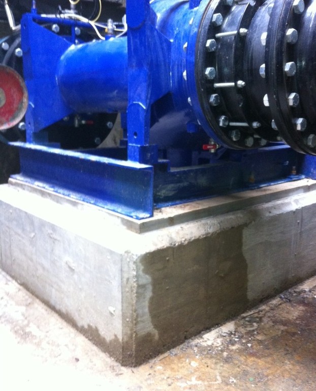 Blue machinery on concrete base