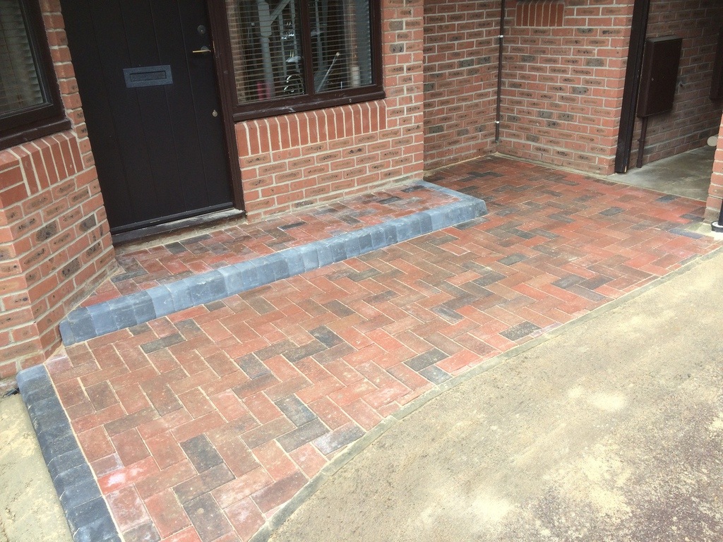 Paved entrance with brick patterns