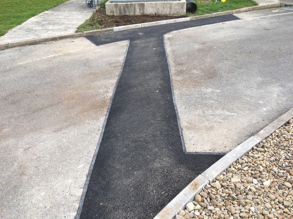 Curved black pavement design