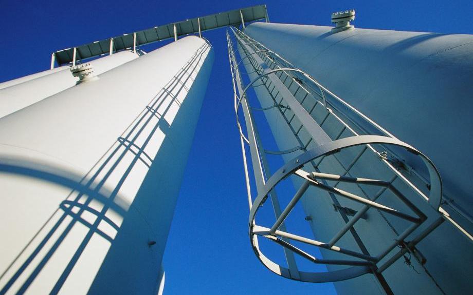 Industrial silos against blue sky